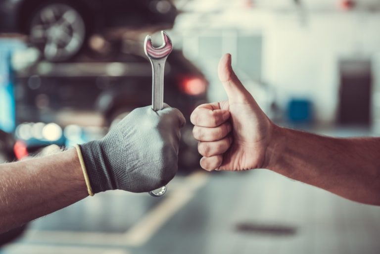 repair man and person giving thumbs up