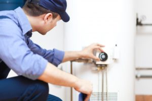 plumber checking heater