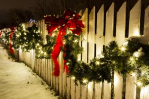 christmas decor on a fence