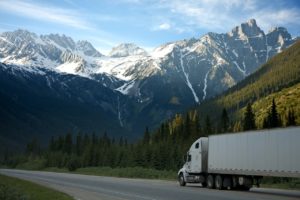 a truck on the road near a mountain