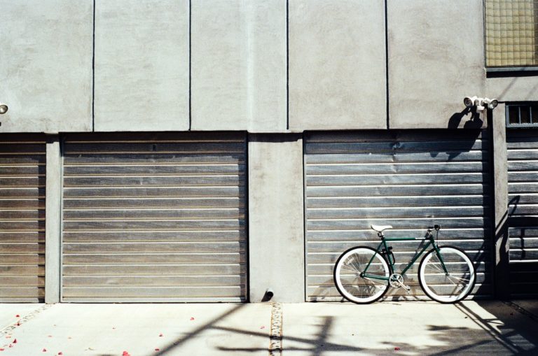 2 garage doors bike urban setting