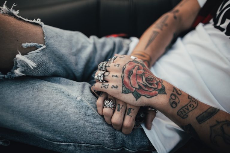 Man with a rose tattoo on his hand