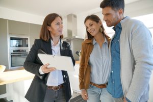 couple speaking to a real estate agent