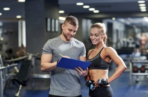 Coach and a woman looking at the paper