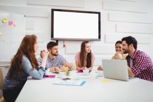 a group of people sitting together for a business meeting