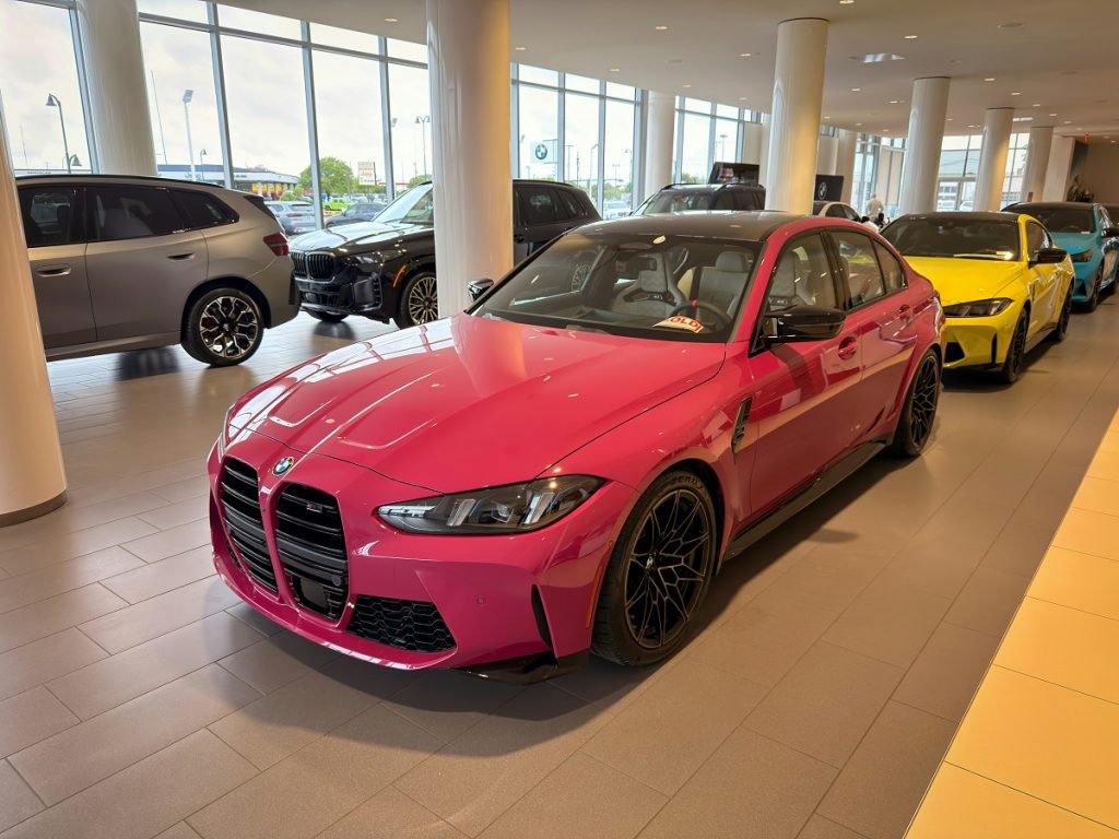 sedans and SUVs in a car dealership