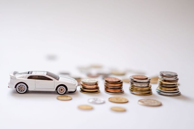 a toy car and stacks of coins